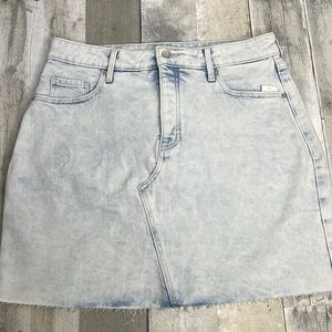 3/$25 Old Navy light wash denim skirt. Button-fly. Unfinished hemline